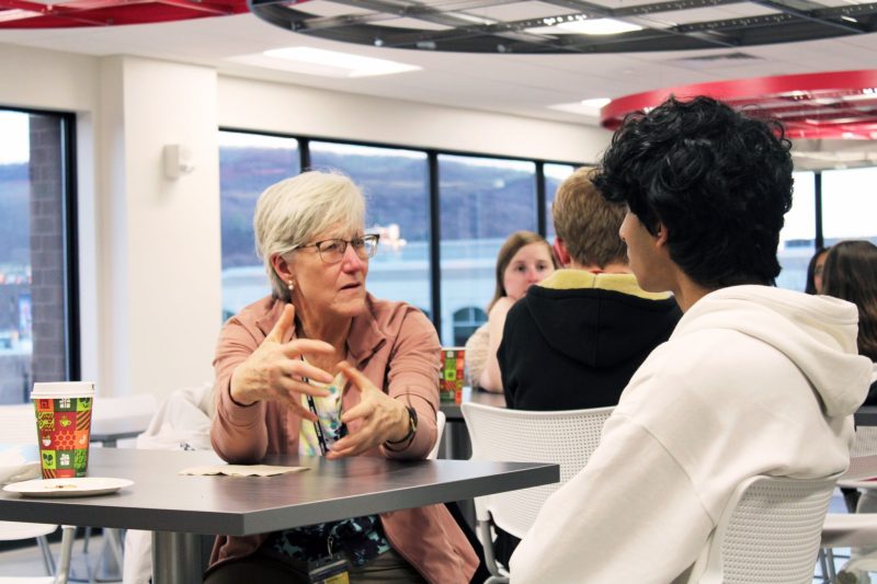 Teacher talking to student