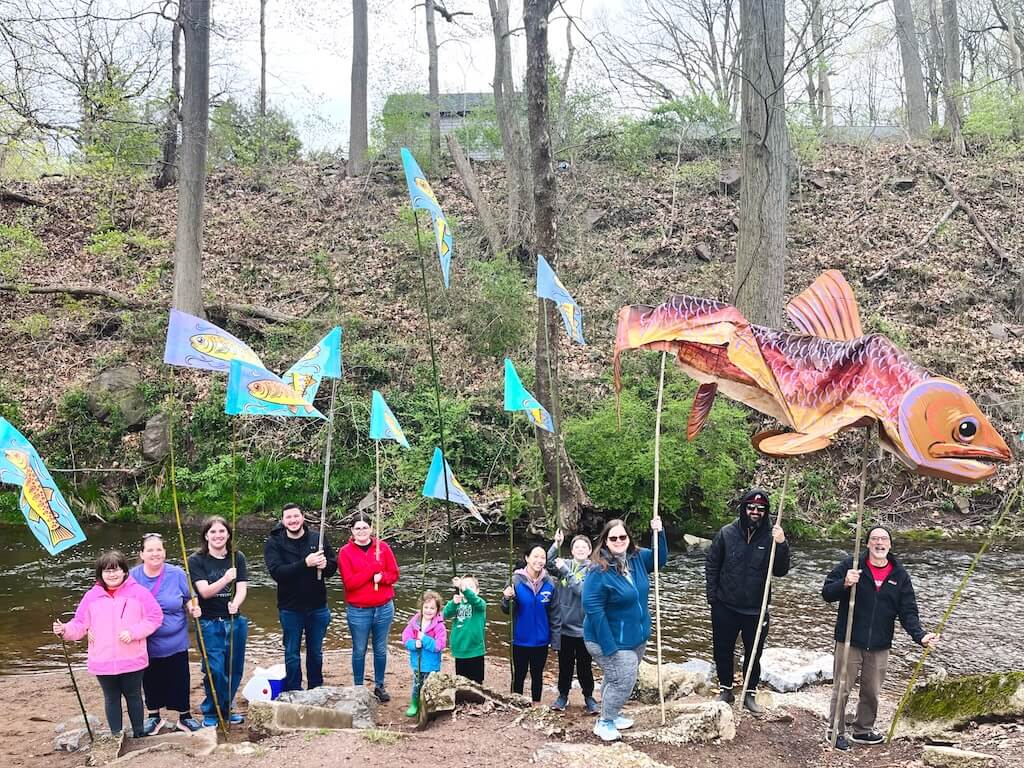 Kids and teachers at a stream