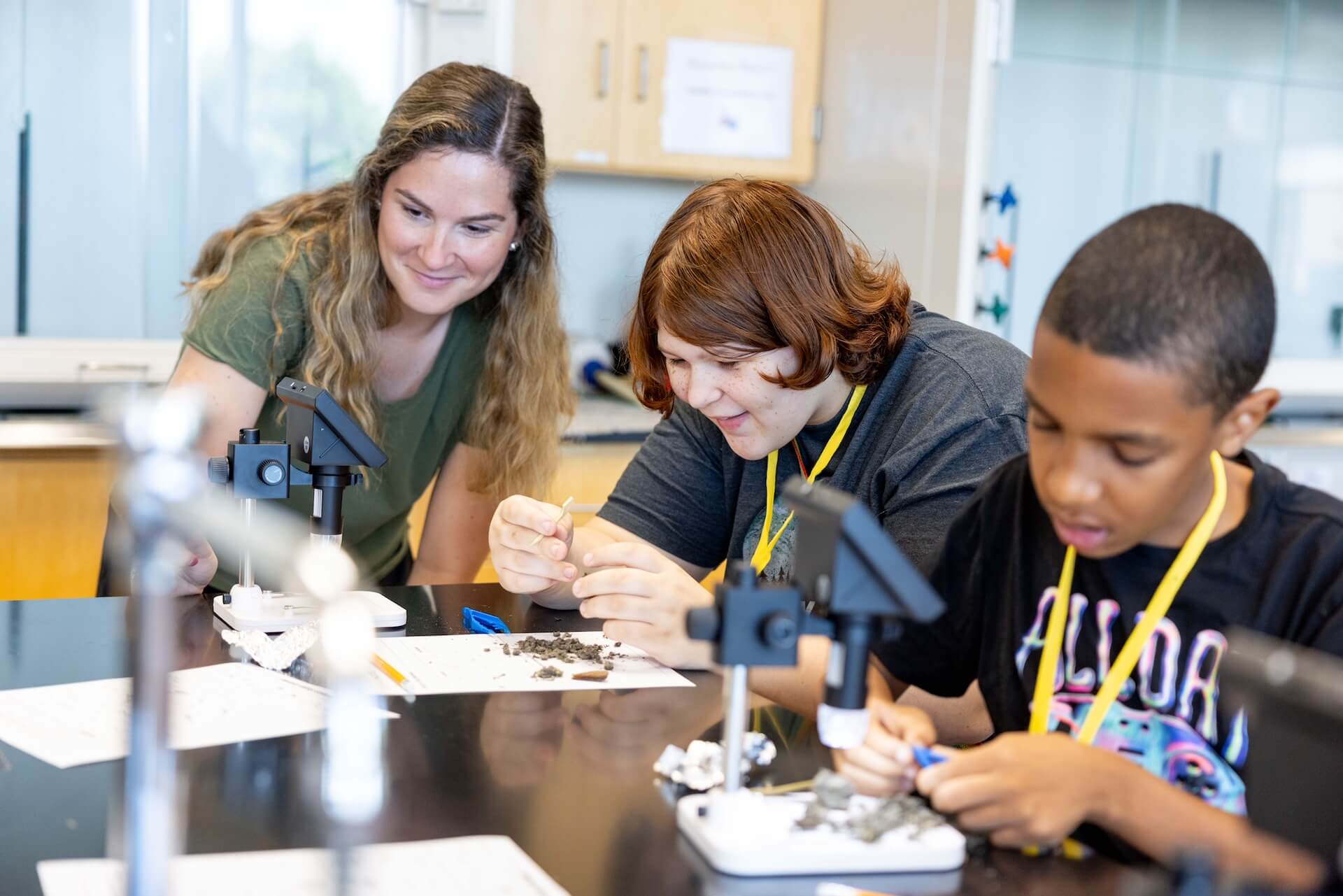 Teacher and student in science class